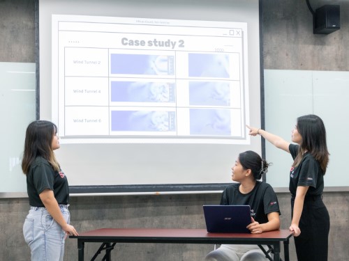 Students comparing results from different cases