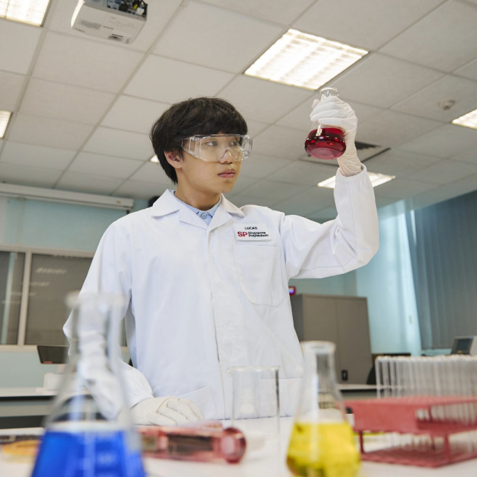 CLS-CLS Landing Student Looking at Chemicals