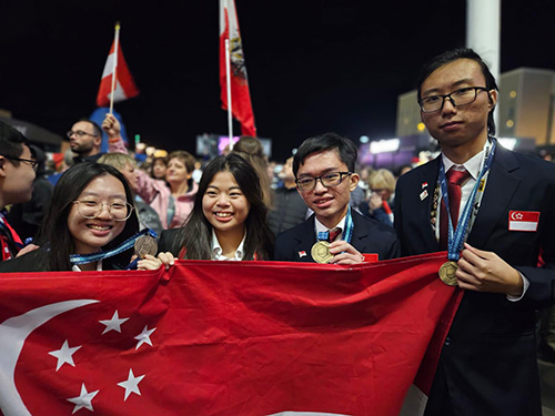 Students holding the Singapore flag