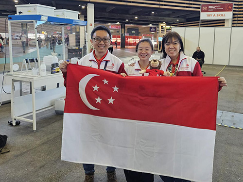 Students holding the Singapore flag