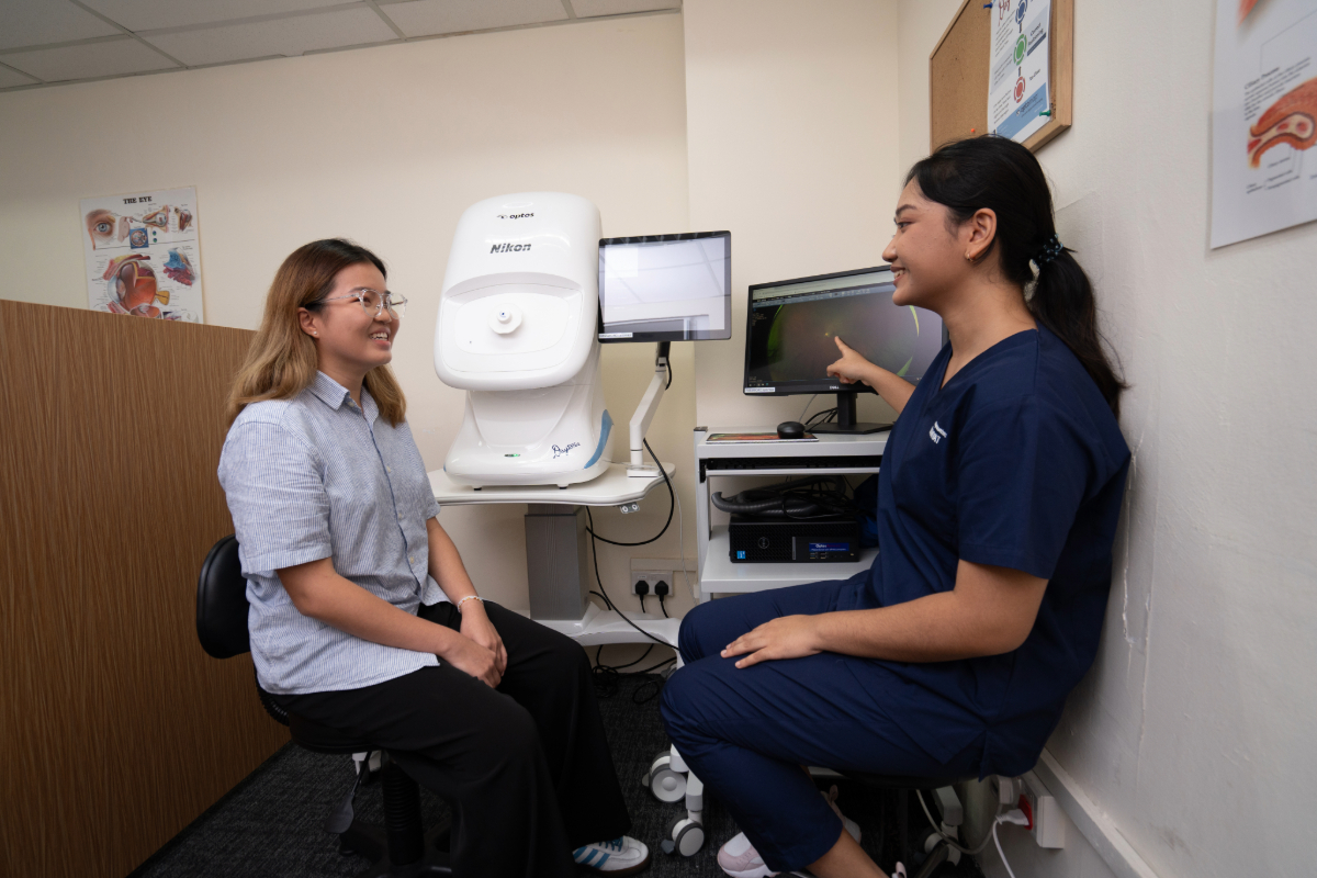 CLS-DOPT Student Showing Patient Her Eye-v01