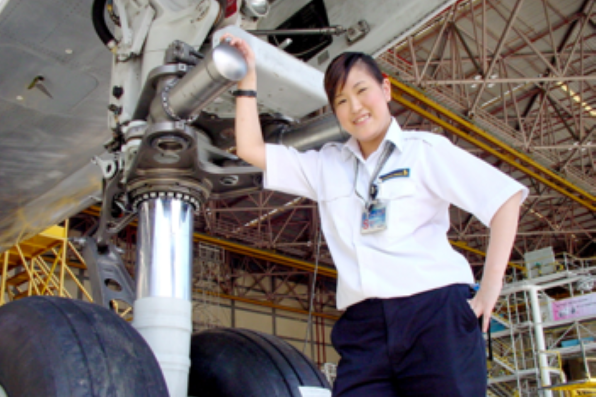 Person beside landing gear