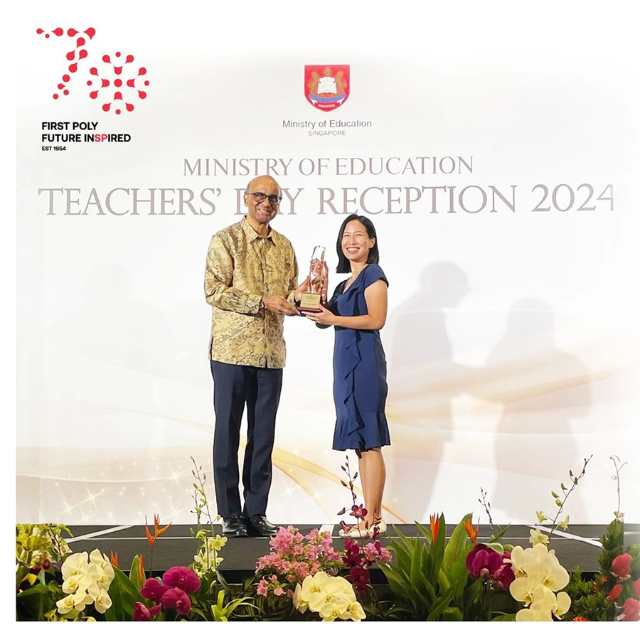 Clarice Sim receiving President's Award for Teachers from President Tharman