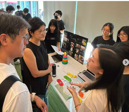 Students presenting at a booth