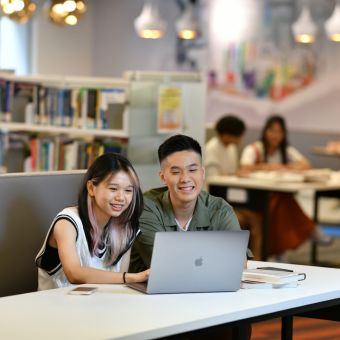 student in library